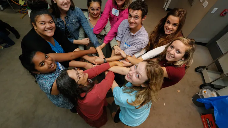 Students from all over the Bay Area get tangled in a human knot to kick off the conference.