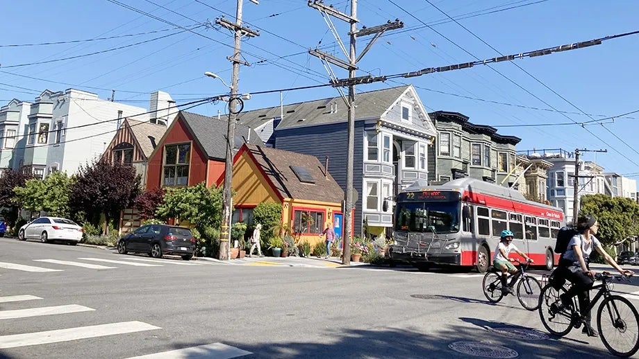 Single and multi-family homes in San Francisco along a Muni bus route.