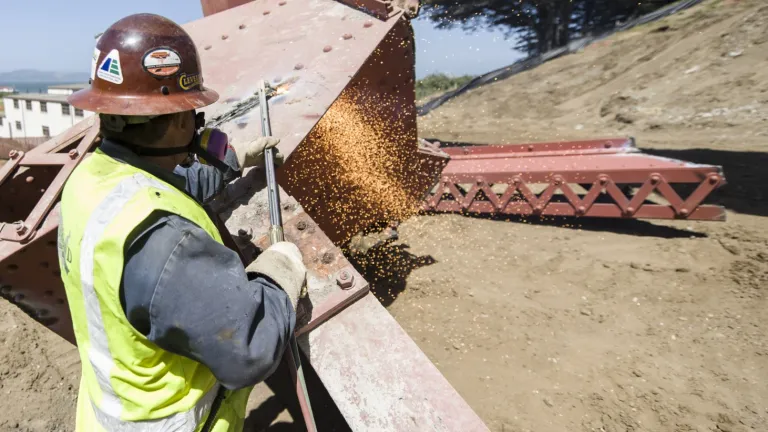 A metal worker welding at the Presidio Parkway/Doyle Drive Construction Project in San Francisco.