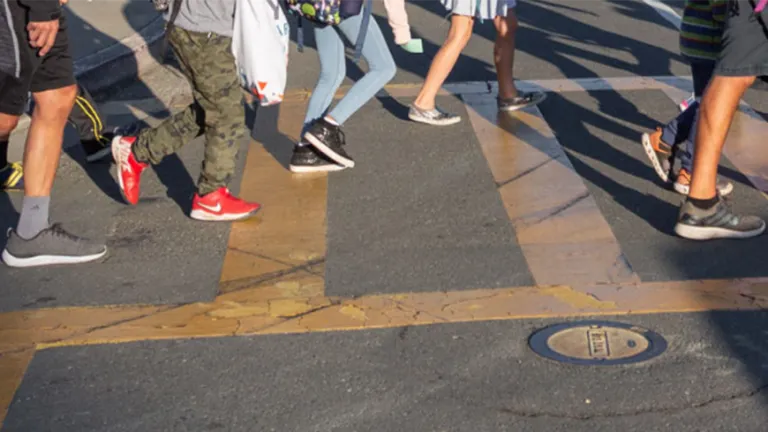 A group of students using crosswalk