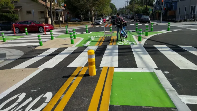 Bike lanes and a crosswalk painted onto an intersection in San Jose.