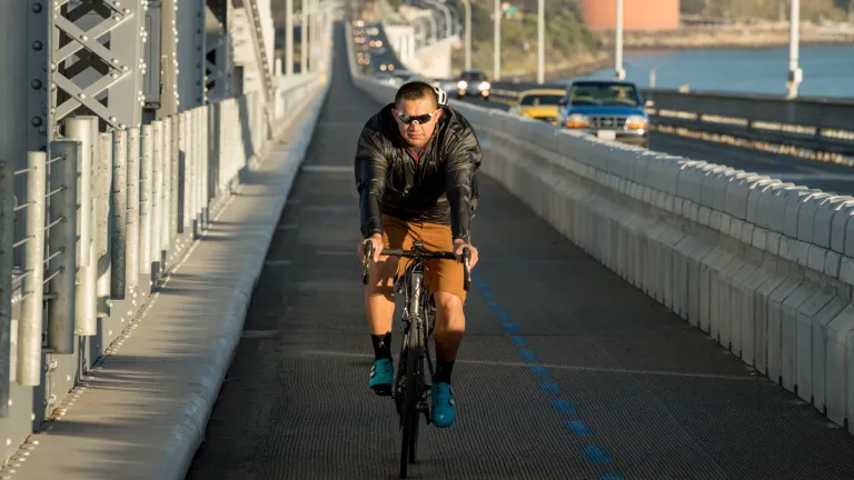 A cyclist riding the path on the Richmond-San Rafael Bridge.