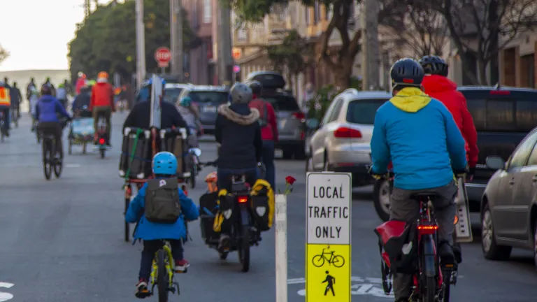 A "bike bus" of children and adults riding to school in San Francisco.
