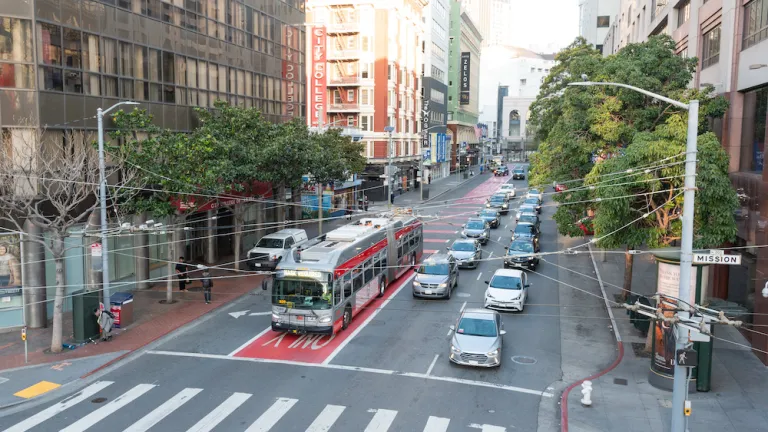 Aerial view over a Muni bus in a bus-only lane in downtown San Francisco.