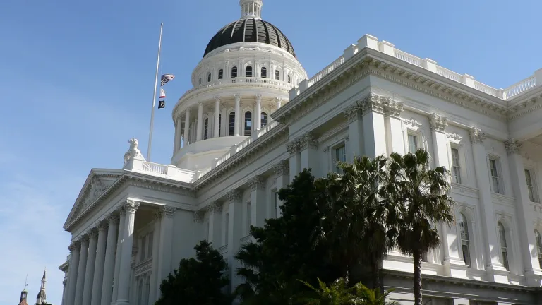 The California State Capitol building with blue skies in the background.