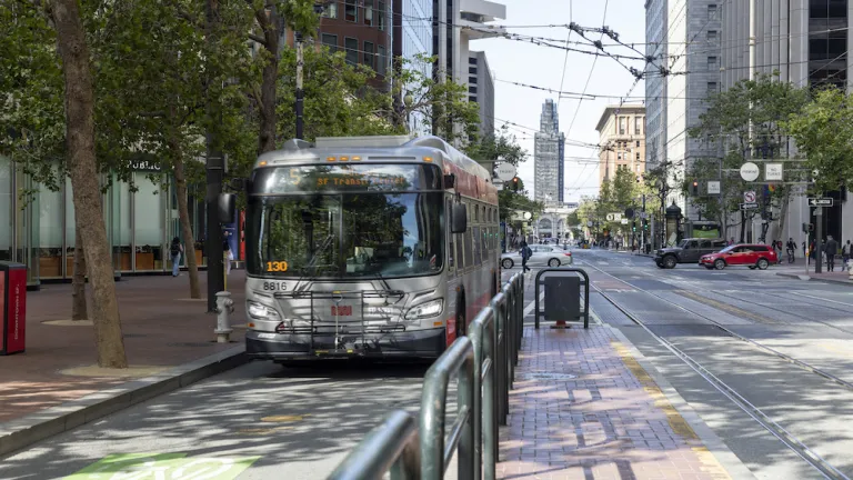 A Muni bus on Market Street in San Francisco.