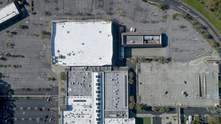 Aerial of a parking lot at an under-used shopping center in Terra Linda, California.