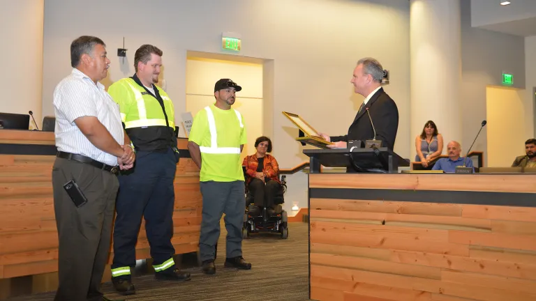 Freeway Service Patrol tow truck drivers Moises Reyes and Darryl Poe, and Waste Management of Alameda County driver David Garcia receive their awards from MTC Chair Dave Cortese
