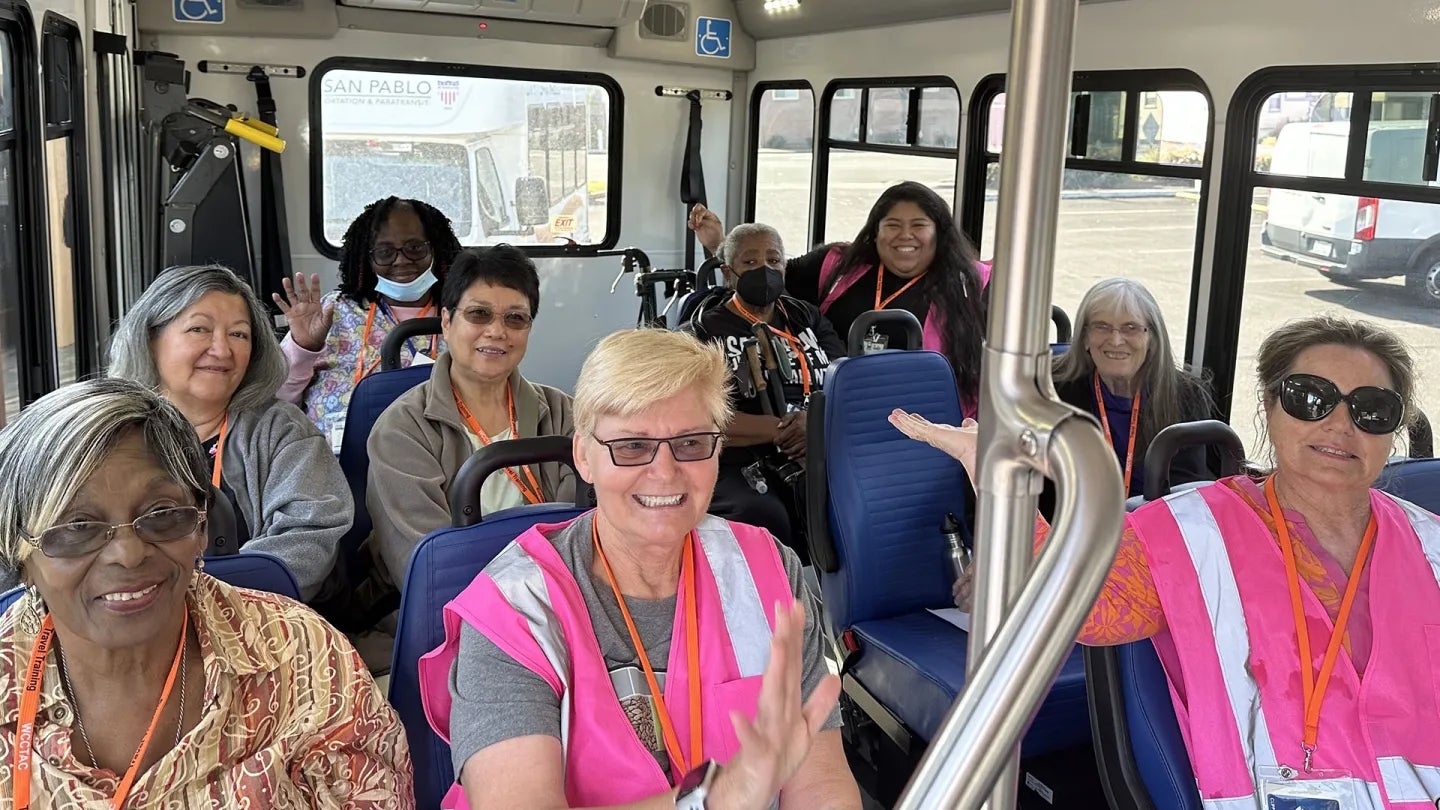 West Contra Costa Transportation Advisory Committee travel trainers and participants on a bus.