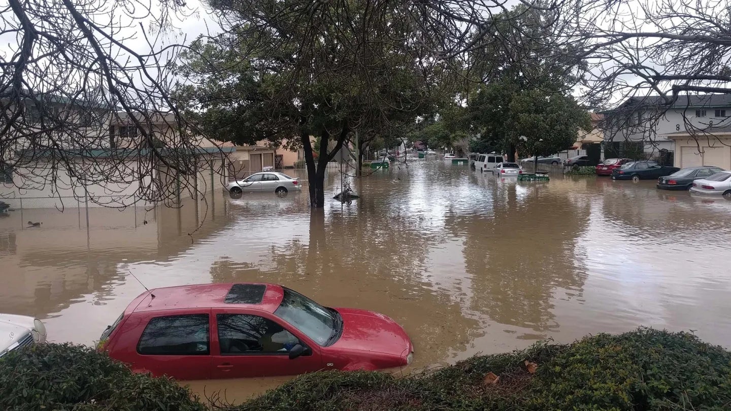 Cars under high flood waters in San Jose.