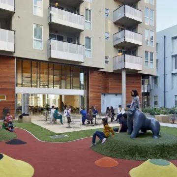 A group of kids playing in outdoor housing playground