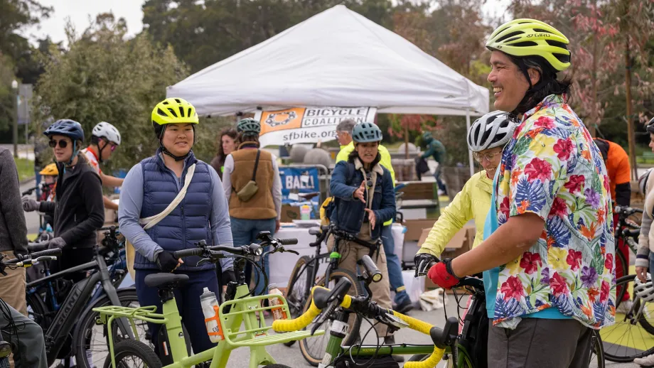 A group of cyclists celebrating Bike to Work Day in Golden Gate Park.