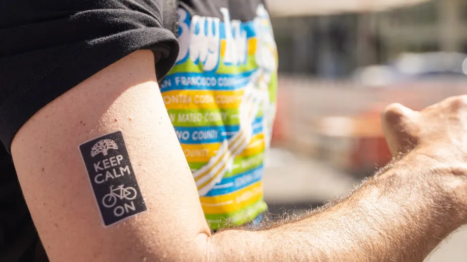 A temporary tattoo that reads Keep Calm and Bike On.
