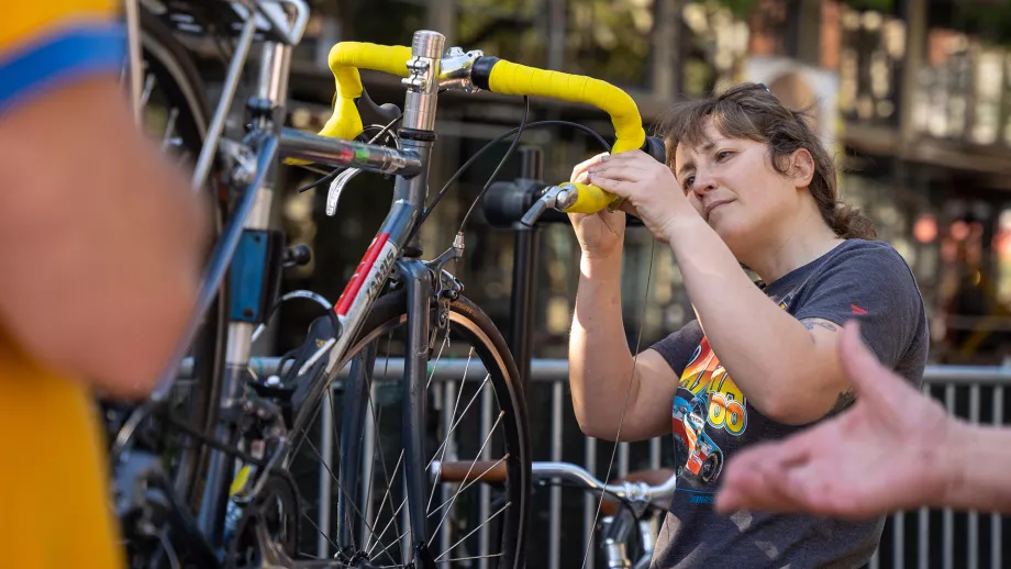 A bicycle mechanic giving a free tune-up on Bike to Work Day.