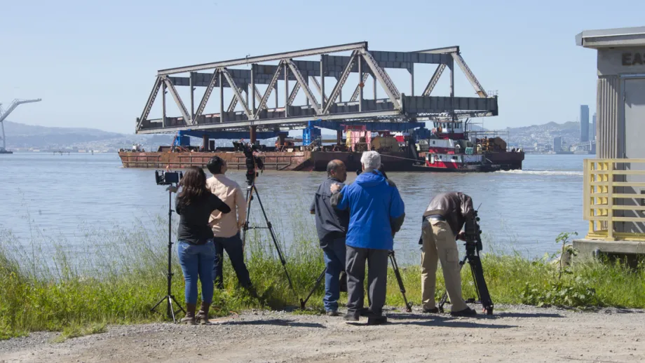 camera crew filming Truss being moved on a barge