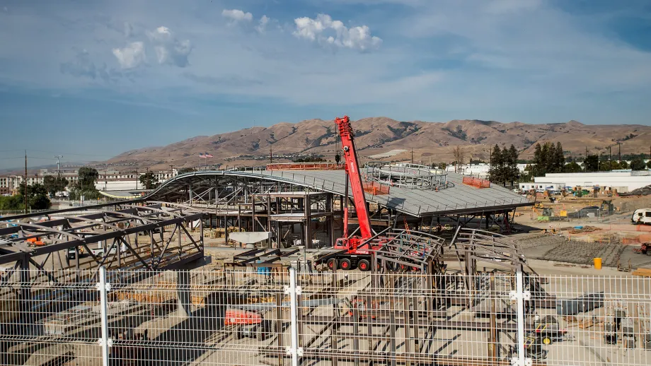 Milpitas BART Station: Crews work on connecting the aerial platforms to the station concourse.