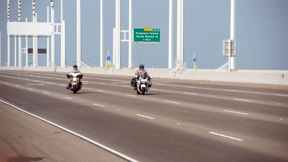 two motorcycles driving on the bay bridge
