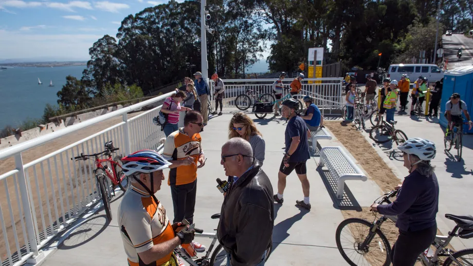 Curious and excited cyclists and hikers gather at the Yerba Buena Island touchdown on opening day.