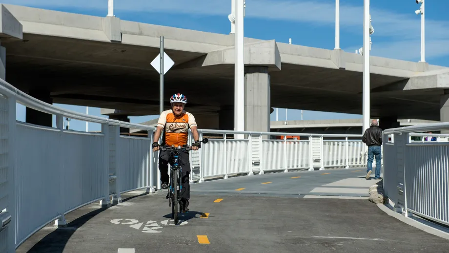 Caltrans District 4 Director (and MTC Commissioner) Bijan Sartipi takes his bike for a spin on the new section of pathway.Walkers and
