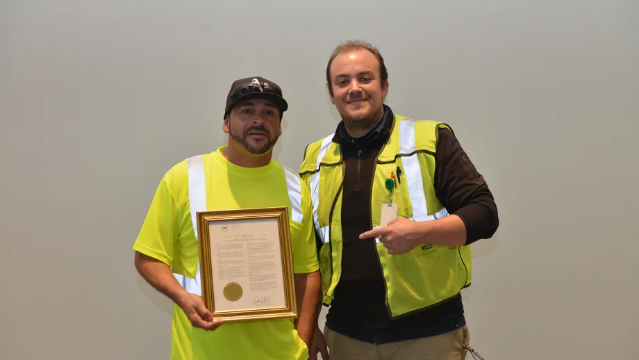 Waste Management of Alameda County driver David Garcia holding his award
