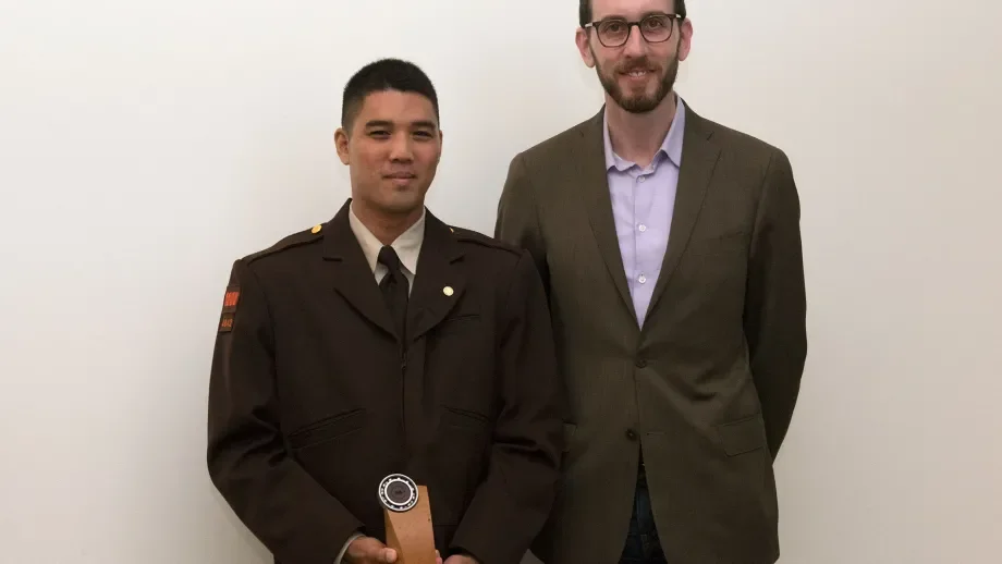 Jose Macasocol poses with MTC Commissioner Scott Wiener after receiving his award trophy