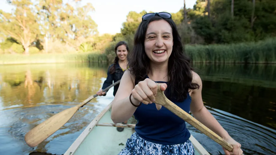 Program Assistant Tira Okamato and Program Manager Marisa Villarreal test out the waters in a boat