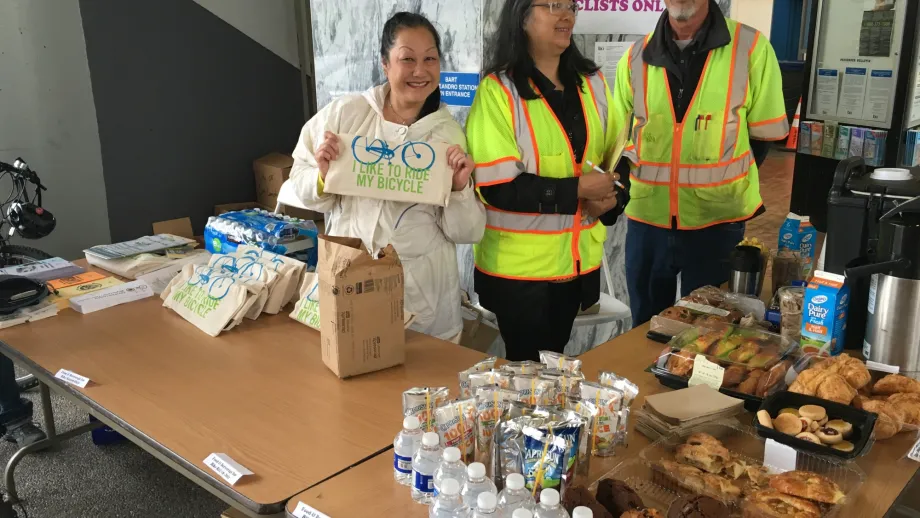 Staff at the San Leandro BART energizer station show off their goodies.