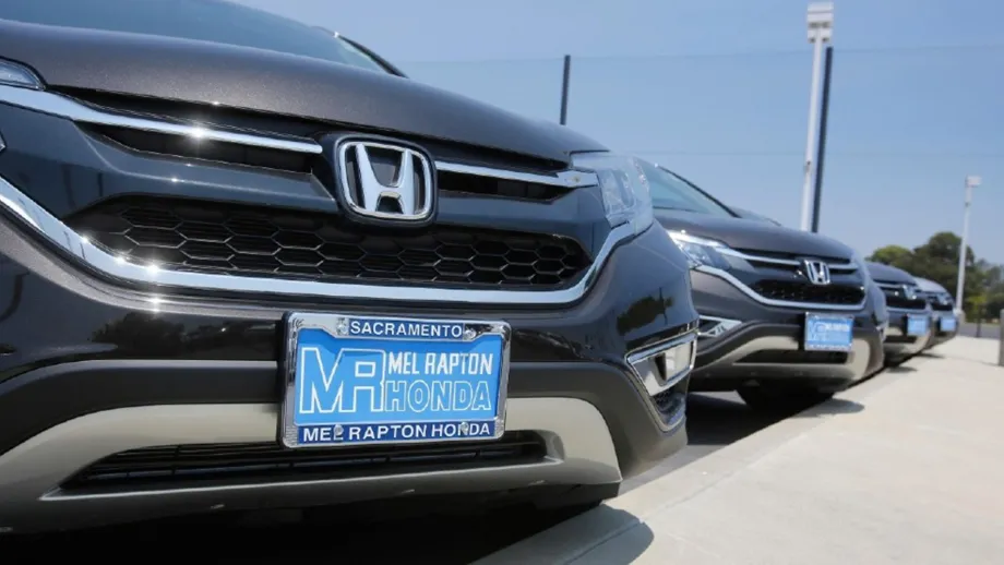A line of Hondas with paper license plates