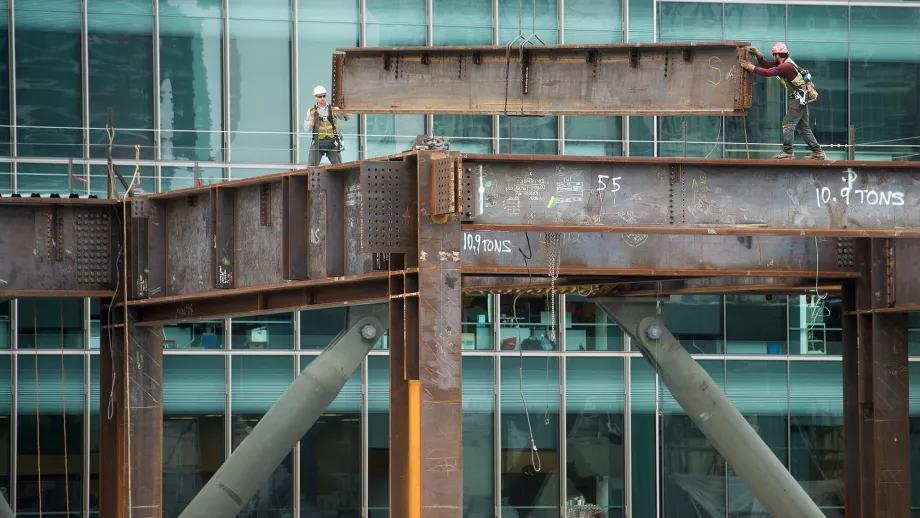 Workers erect the support beams for the Transbay Terminal