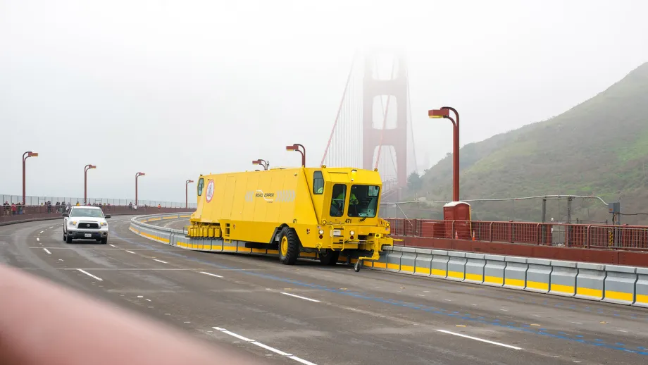 Zipper truck moves the barrier on a foggy Golden Gate Bridge