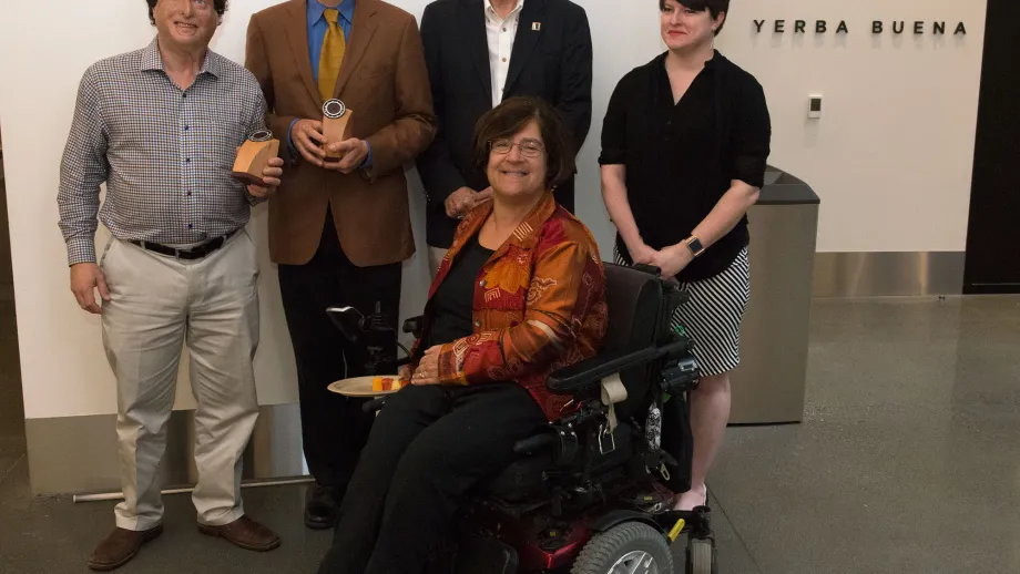 2016 Doris W. Kahn Accessible Transportation Award winners Dr. Joshua Miele and Greg Kehret pose for a photo with MTC Commissioners Tom Bates and Dorene Giacopini