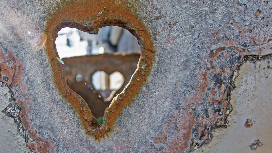 heart-shaped hole in a piece of salvaged steel