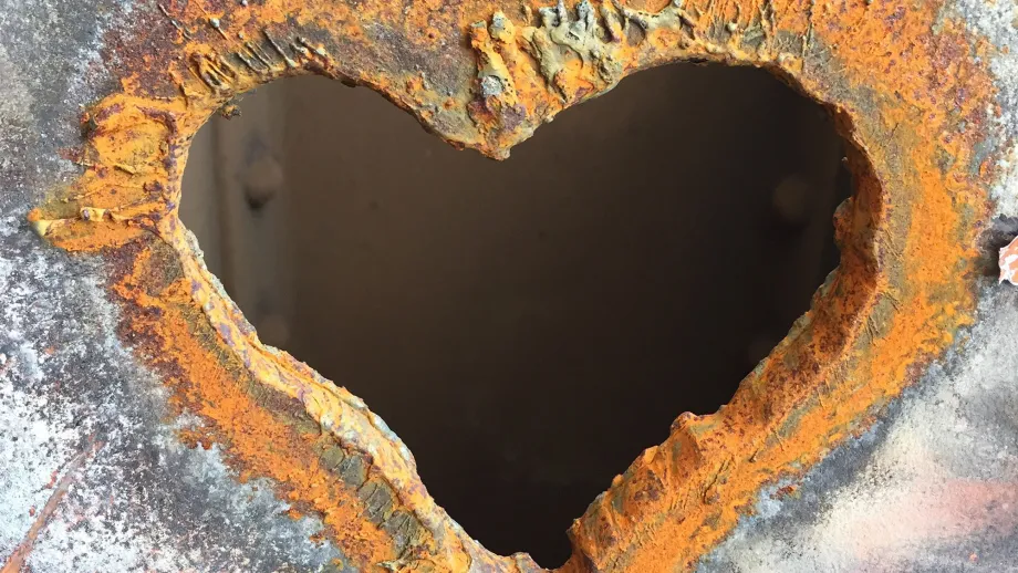 Viewed here is a slab of steel in which a heart shape has been torched. 