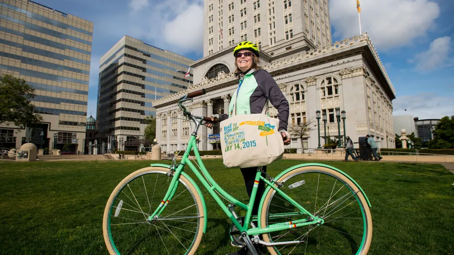 Gail Robinson poses with a Public bike she won on Bike to Work Day
