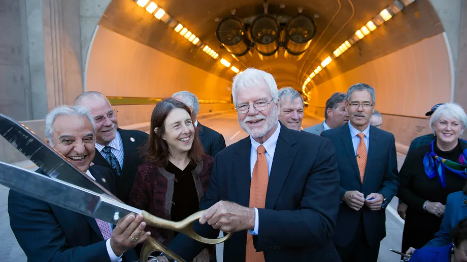 Congressman George Miller leads the Fourth Bore's ceremonial ribbon cutting. 