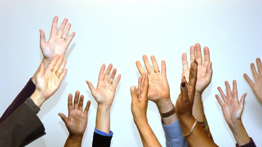 A group of raised hands