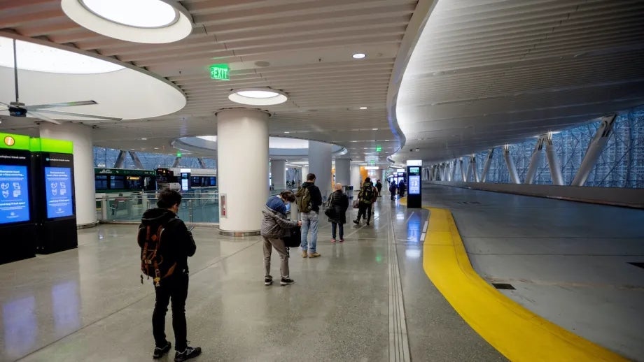 Passengers waiting for a bus at the Salesforce Transbay Transit Center.