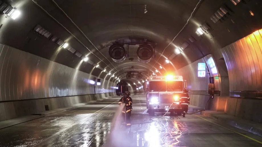 Firefighters running a safety exercise inside the Caldecott Tunnel.