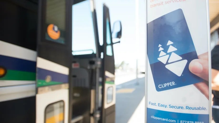 Sign for Clipper® card in front of a public bus.