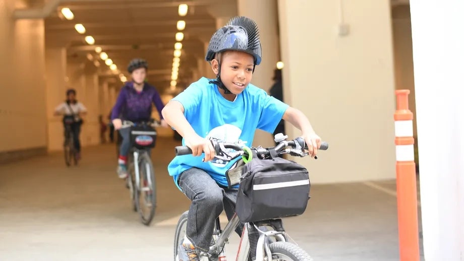 Children riding bikes at the YES Conference.