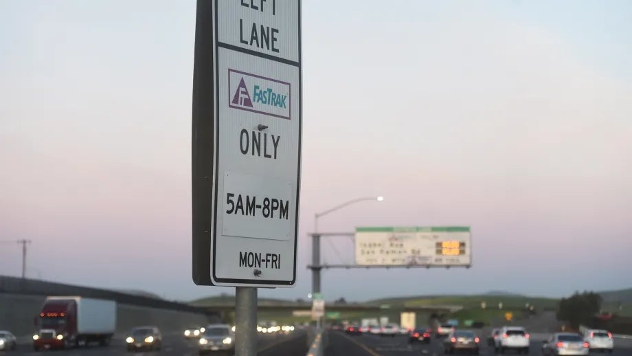 Highway sign that reads, "FasTrak only 5 a.m. to 8 p.m. Monday to Friday."