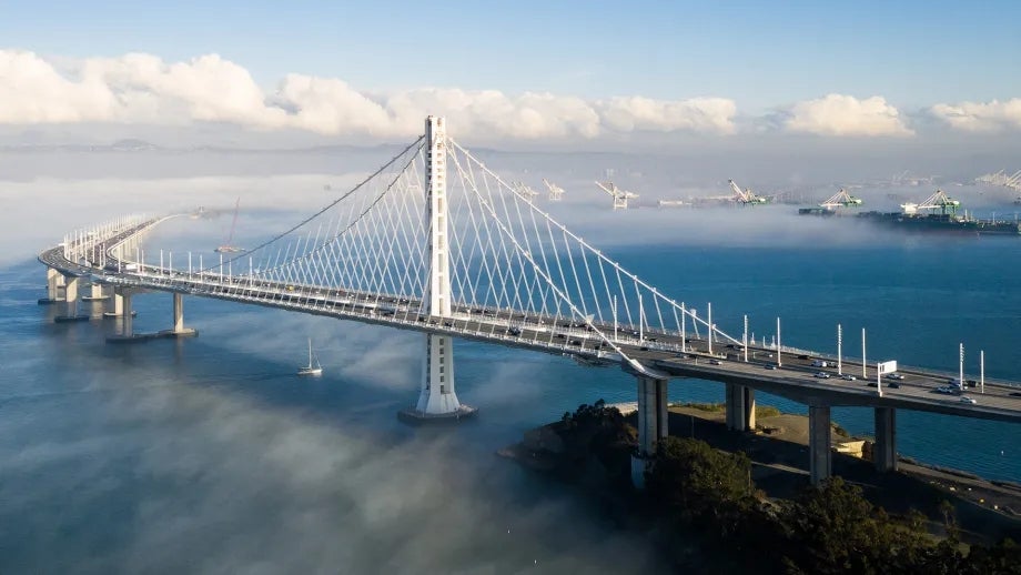 A beautiful photo showing the length and lines of the San Francisco-Oakland Bay Bridge.