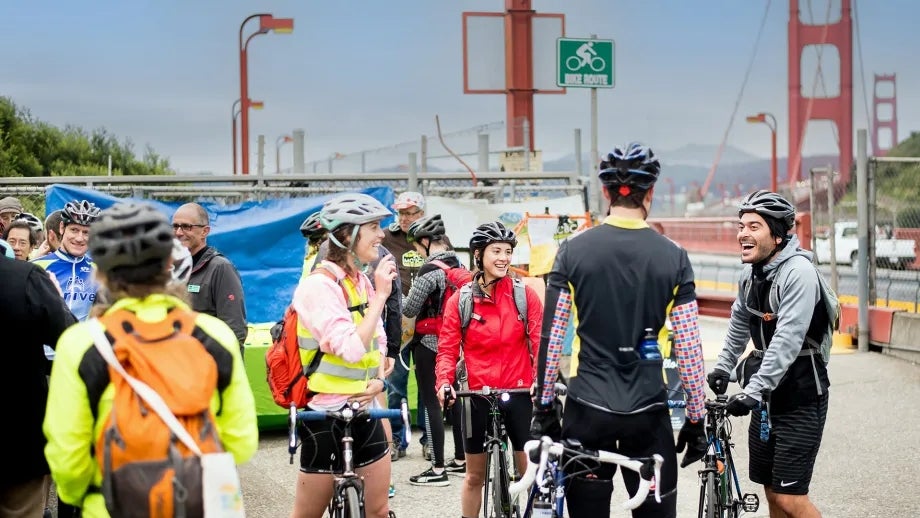 Cyclists gather at the north end of the Golden Gate Bridge.