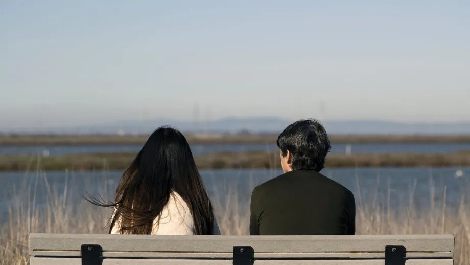Two people on a Bay Trail park bench enjoying the view.