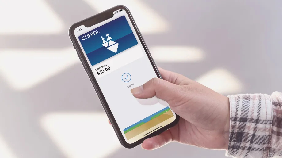 A person looking at their Clipper card in the Apple Wallet app.