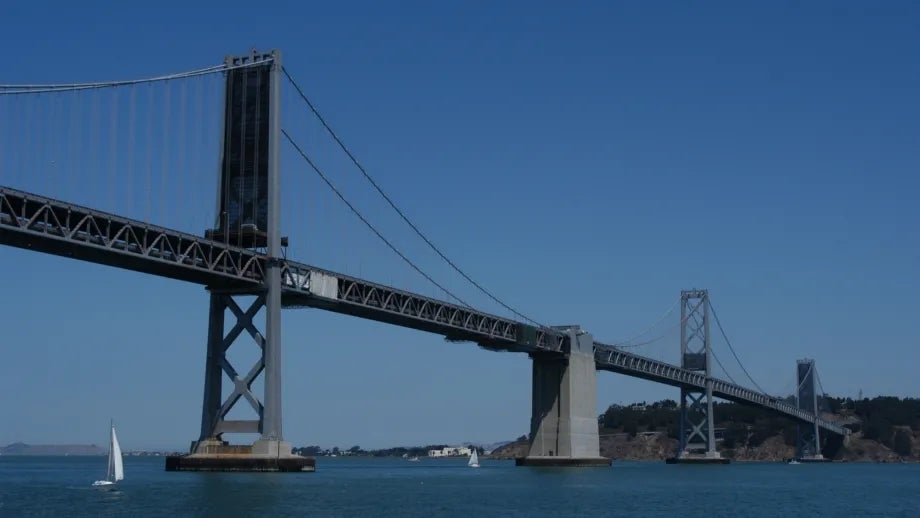 A view of the Bay Bridge West Span and Yerba Buena Island from the water below