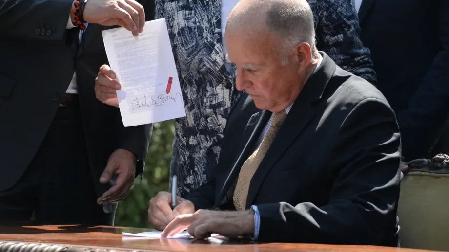 Governor Brown signing bills