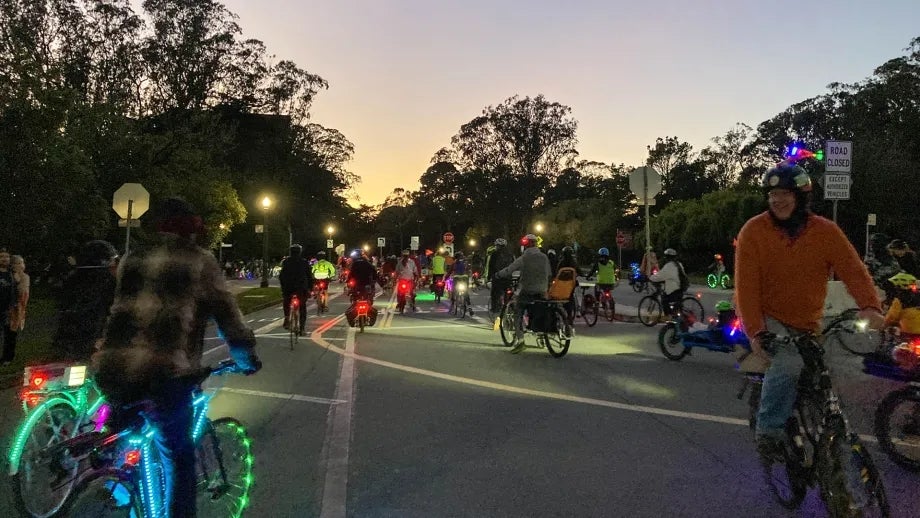 Cyclists with highly visible lights at night in Golden Gate Park in San Francisco.