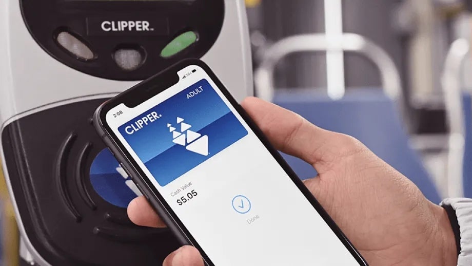 A person using the Clipper Mobile app on their phone to pay for a ride on Bay Area transit.