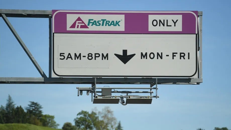 A sign indicating when FasTrak is required to use the lane on the highway.